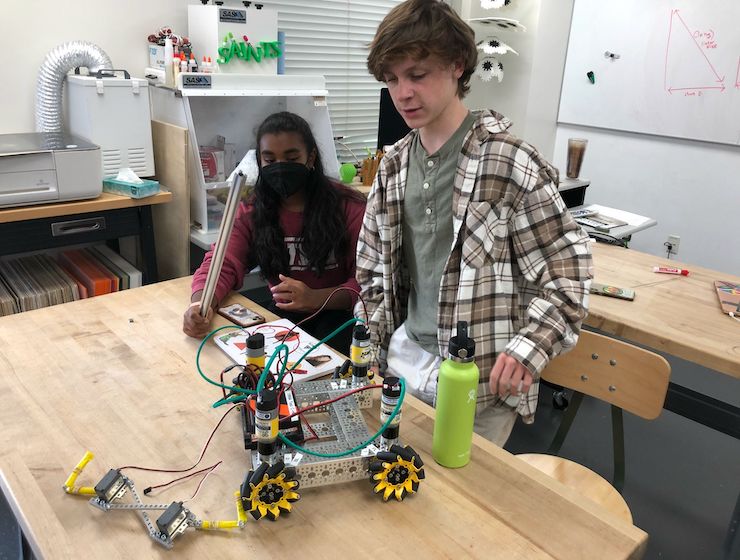 Student displaying his robot